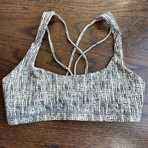Gently used dark green patterned sports bra, small.